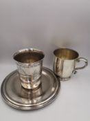 A Victorian sterling silver handled christening cup with engraved monogram along with a white