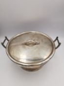A Victorian Goldsmith and Silversmith's twin handled lidded silver bowl. Hallmarked:CBEP,London,