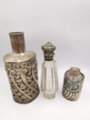 Three silver perfume bottles, one cut crystal with hinged silver repousse top set with turquoise and