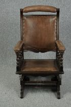 Rocking chair, 19th century oak spring action in leather upholstery.