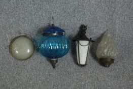 An assortment of lightshades including an Art Deco frosted flame and a blue Moroccan hanging