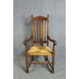 Armchair, C,1900 oak in the Jacobean style.