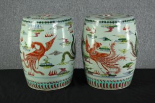 Two porcelain Chinese drum shaped stools. Decorated with red phoenix. Early twentieth century.