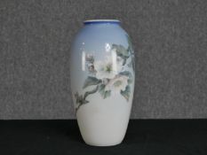 Royal Copenhagen. Porcelain vase with floral decoration. H.28 W.14 cm.