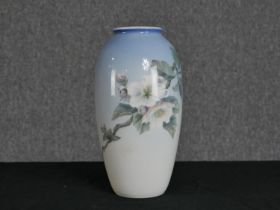 Royal Copenhagen. Porcelain vase with floral decoration. H.28 W.14 cm.