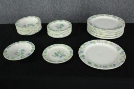 A ten person Poole pottery floral and foliate design studio pottery dinner set. Makers mark to base.