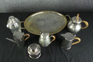 A silver plated tray plus six other items to include cocktail shaker. Four with raffia handles.