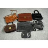 A collection of vintage leather handbags, purses and cases. The largest measures H.29 cm.