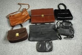 A collection of vintage leather handbags, purses and cases. The largest measures H.29 cm.