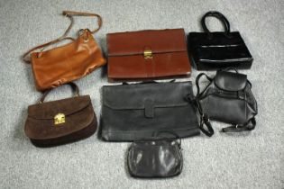 A collection of vintage leather handbags, purses and cases. The largest measures H.29 cm.