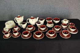 Coffee and tea set. Incomplete. Mid twentieth century with a spotted and floral decoration. The