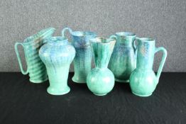 A collection of four Art Deco Beswick porcelain jugs and two vases. Circa 1930. The tallest measures