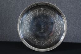 A large and heavy silver plated platter. With a diameter of 51 cm and a monogram and crown at the