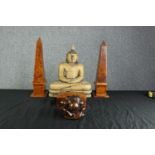 A collection of hardwood items. Two Buddhas, two matching Obelisks, and a Tea caddy. The two