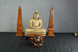 A collection of hardwood items. Two Buddhas, two matching Obelisks, and a Tea caddy. The two