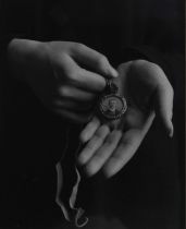 Jane E. Clark. Photograph. Hands holding a locket. From the artis'ts Great War series of works.