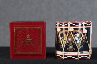 Two ice buckets. One made by Dunhill and the other in the shape of a Royal Marines marching drum.