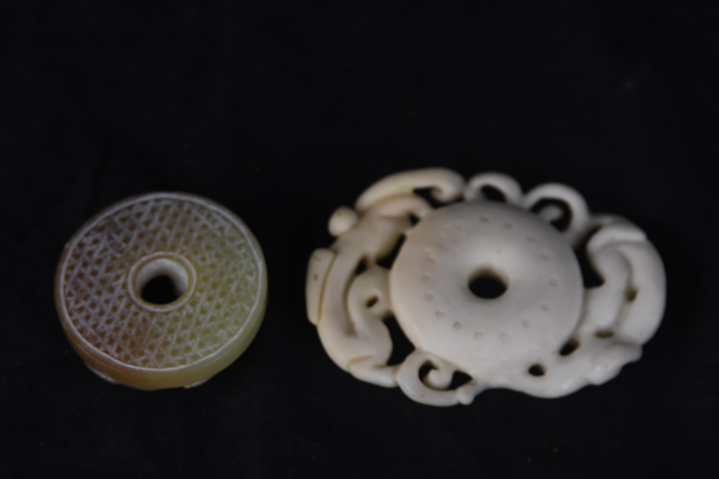 Two Chinese bi disks made of jade and soapstone. The jade design features what looks like tigers and - Image 2 of 3