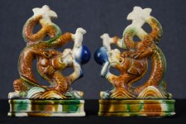 A pair of Chinese ceramic dragons finished in a Sancai glaze. Possibly bookends. H.20 W.13 D.4 cm.
