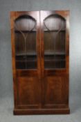 Library bookcase, 19th century flame mahogany. Cornice missing. H.186 W.101cm.