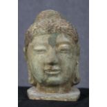 Buddha with domed Ushnisha (symbol of his Enlightenment) metal and polychromed hair. The face has