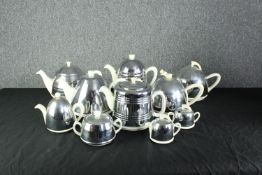 A collection of Heatmaster items including teapots, coffee pots, a sugar bowl, creamer and other