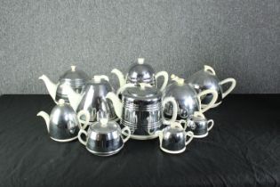 A collection of Heatmaster items including teapots, coffee pots, a sugar bowl, creamer and other