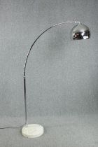 An arc floor standing lamp with marble base and chrome shade. H.183 cm.