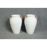 Pair of glazed terracotta urns. Each measuring H.45.5 cm.