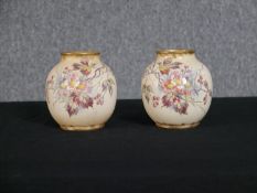 Two Royal Bonn pots. Both stamped on the base. With floral decoration and gilt edges. H.13 x W.18