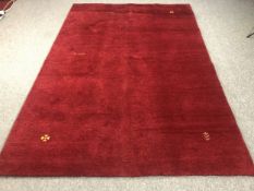 A large contemporary and unused Indian hand made woollen carpet. L.241 W.191cm.