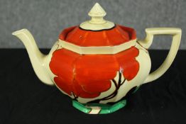 Clarice Cliff. A Bizarre Fantasque teapot, hand painted pattern with printed factory marks. H.17