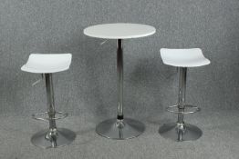 High table and matching stools, contemporary chrome and moulded with adjustable action. H.91 Dia.