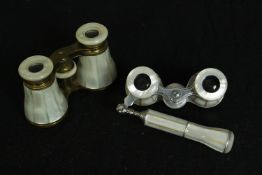 Two pairs of mother of pearl opera glasses. One with a telescopic handle. Each measure W.12 D.7 cm.