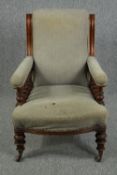 Library armchair, late 19th century oak in original upholstery.