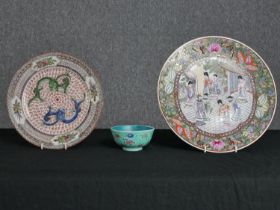 Two heavily decorated Oriental plates and a bowl. Stamp with the artists seal on the base. Mid