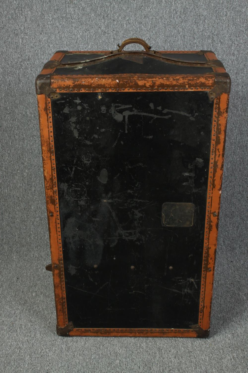 A vintage fitted leather and metal bound steamer trunk. H.100 W.58 D.43cm.