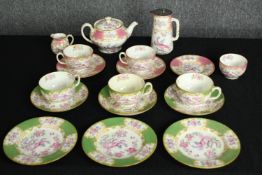 A mixed Minton tea set of six cups, nine saucers, a creamer, teapot, coffeepot and a sugar bowl.