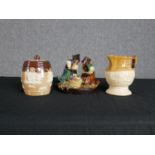 Assorted porcelain to include a Doulton jug, tobacco jar and Staffordshire figures. H.14 x W.15 cm.