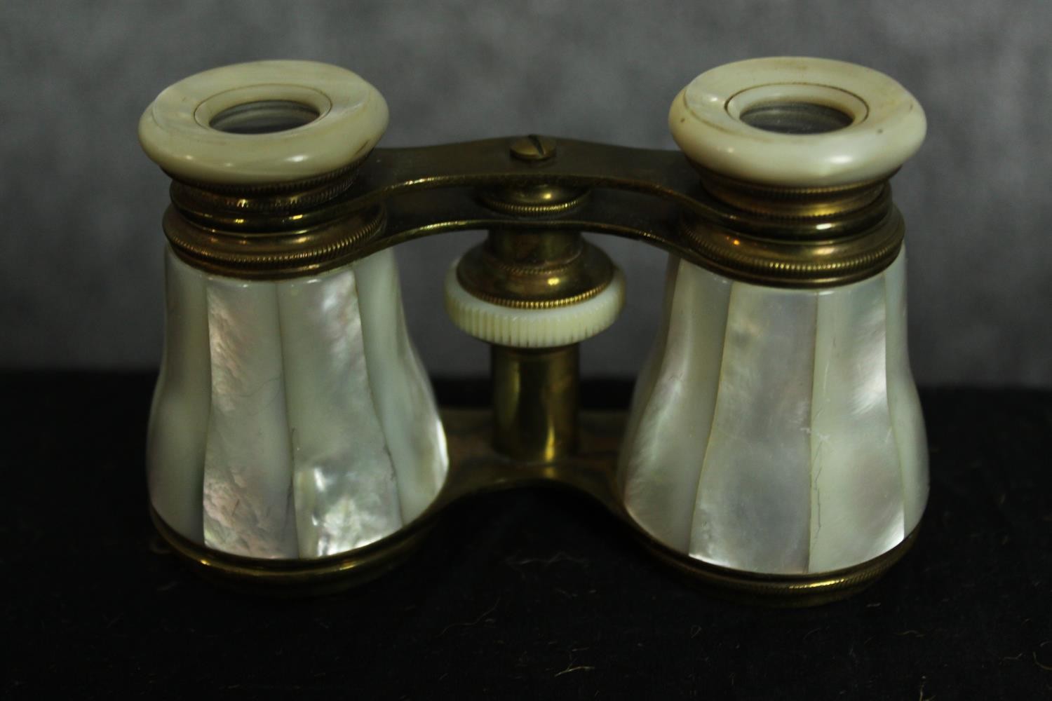 Two pairs of mother of pearl opera glasses. One with a telescopic handle. Each measure W.12 D.7 cm. - Image 2 of 5