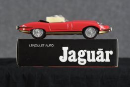 Two Jaguar E Type toy cars. Hungarian. Twentieth century. Each measuring H.8 W.28 D.11 cm.