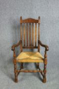 Armchair, C,1900 oak in the Jacobean style.