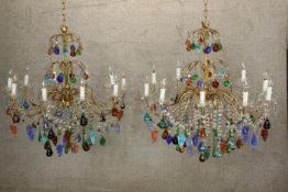A pair of early twentieth century coloured Murano glass twelve branch chandeliers. Suspended with