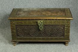 Coffer, Eastern carved hardwood with pierced and studded brass mounts. H.44 W.83 D.39cm.