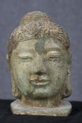 Buddha with domed Ushnisha (symbol of his Enlightenment) metal and polychromed hair. The face has