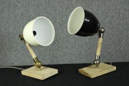 Two wall mounted bedside lamps. Brass and wood with ceramic shades. Each measure H.20 Dia.10 cm.