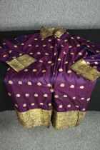 An early 20th century padded long jacket made of purple and gold Indian silk saree fabric with