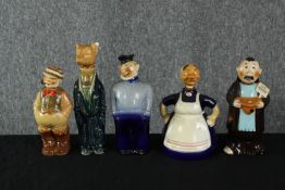 A collection of five vintage hand painted ceramic decanters modelled as various figures, including