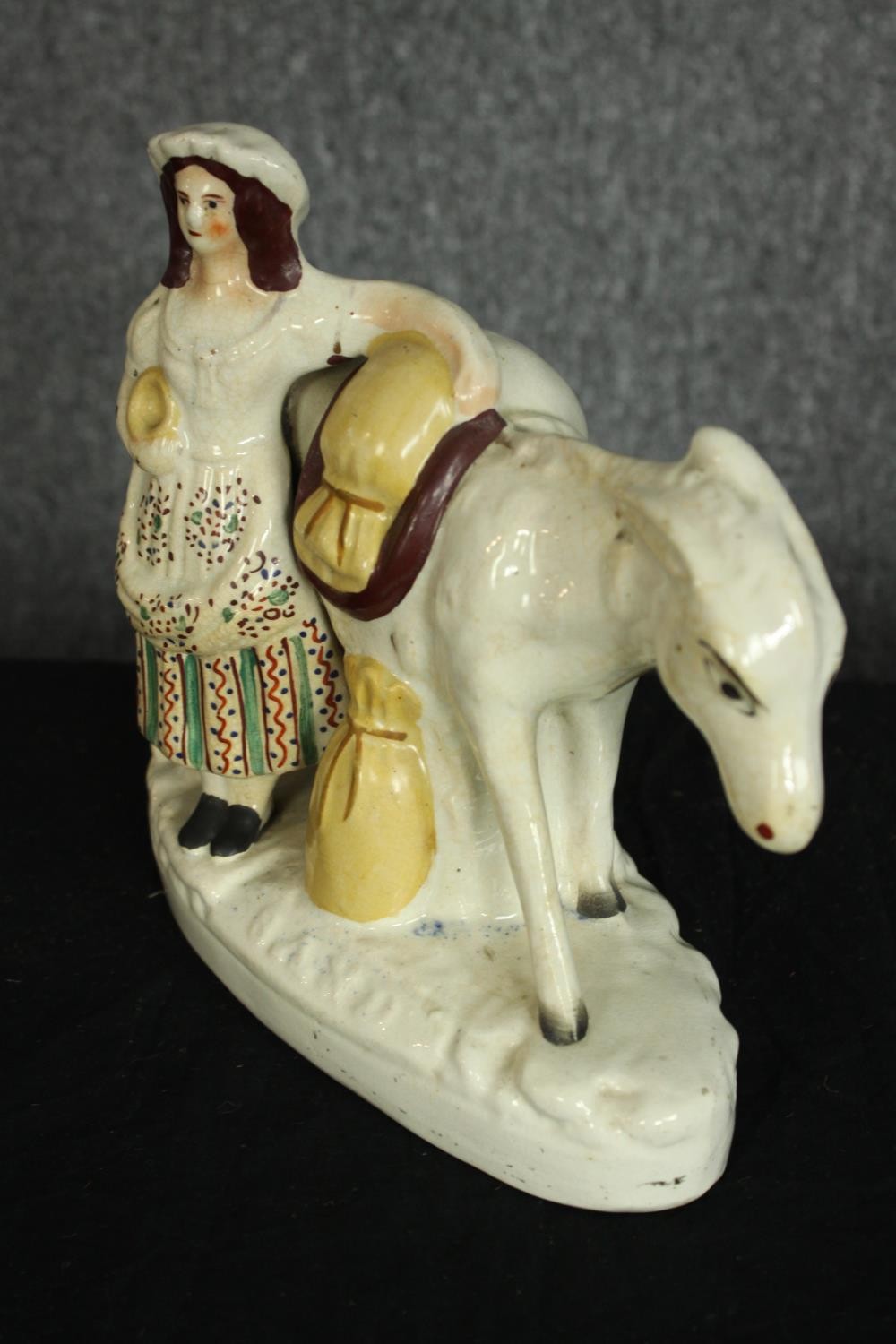 Staffordshire figure. 'Beesom'. A pedlar and donkey carrying sand. Circa 1880. H.21 x W.21 cm. - Image 2 of 4