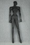 A flat silhouette mannequin. H.180 W.56 cm.